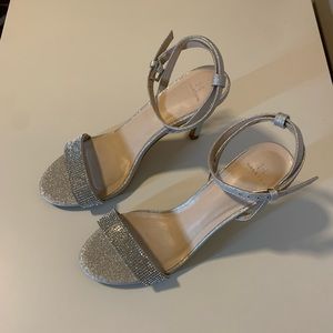 Silver open toed heels.
